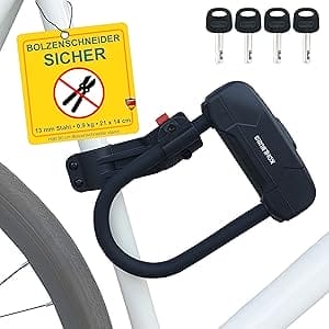 Leichtes Sicherheits-Bügelschloss "Budapest" an einem weißen Fahrradrahmen befestigt, Warnschild rät von der Verwendung von Bolzenschneidern ab; enthält vier Schlüssel.