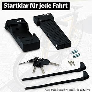 Sicherheits-Faltschloss "Catania" mit Schlüsseln, Montagematerial vor unscharfem Fahrrad.